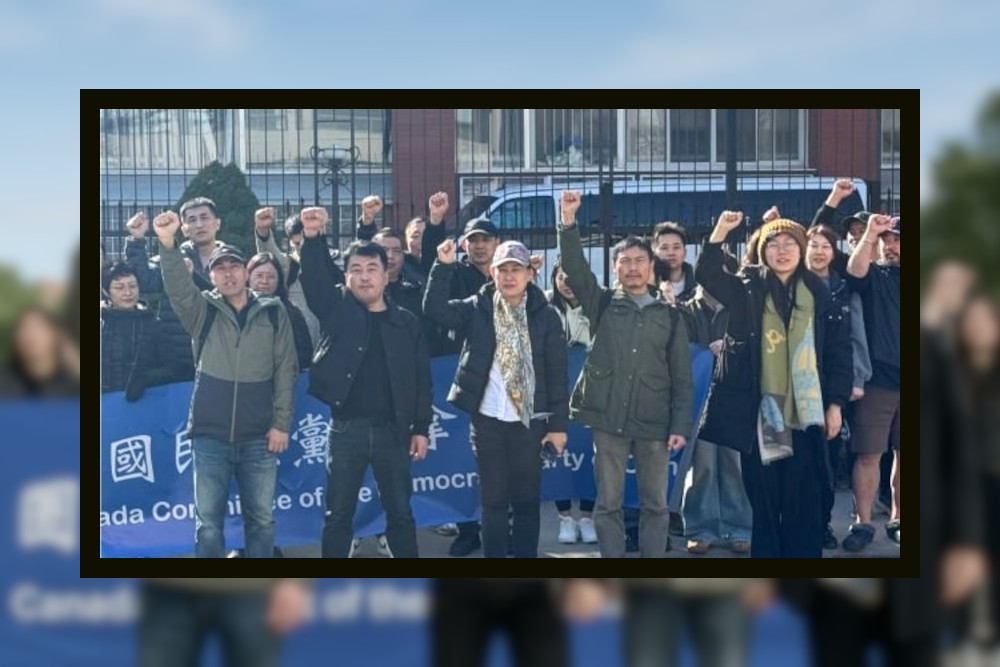 Xu Lifeng and his daughter participating in a rally supporting democracy for China being held in front of the Chinese Consulate in Toronto, Canada.