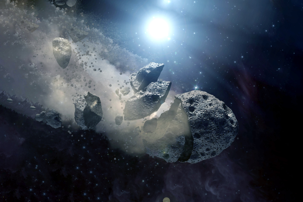 Artist rendering of an asteroid breaking up in space.