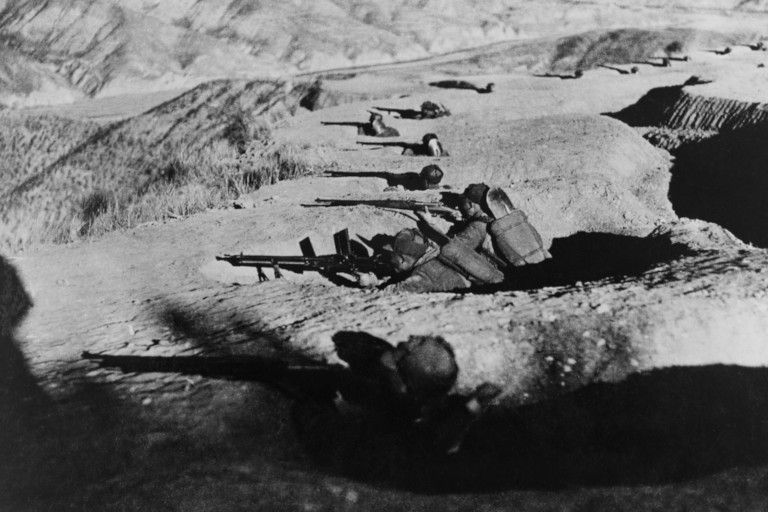 Chinese soldiers in foxholes during the Second Sino-Japanese war.