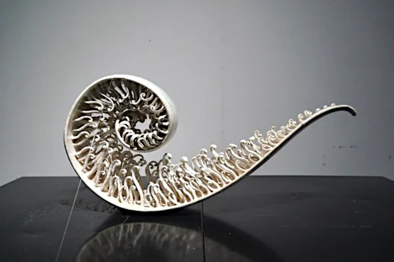 Sculpture by artist Peng Yamei titled 'Sea Waves'.