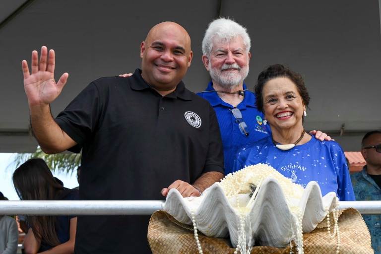 From left, Lt. Gov. Josh Tenorio, Jeff Cook, the First Gentleman of Guam, and Gov. Lou Leon Guerrero attend the 81st Guam Liberation Day Parade in Hagåtña, Guam, July 21, 2025.