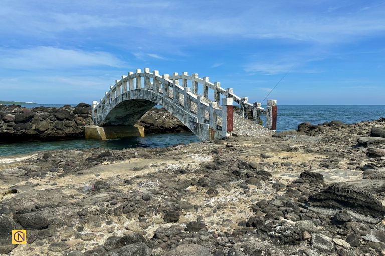 Tucked within a rugged reef area, the elegant white arch is affectionately known as 'Lovers’ Bridge.'