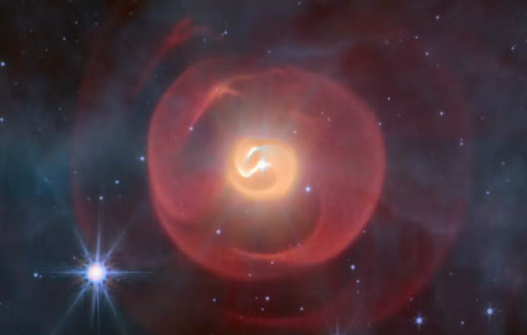 The Apep nebula in false color, displaying infrared data from JWST’s MIRI camera.