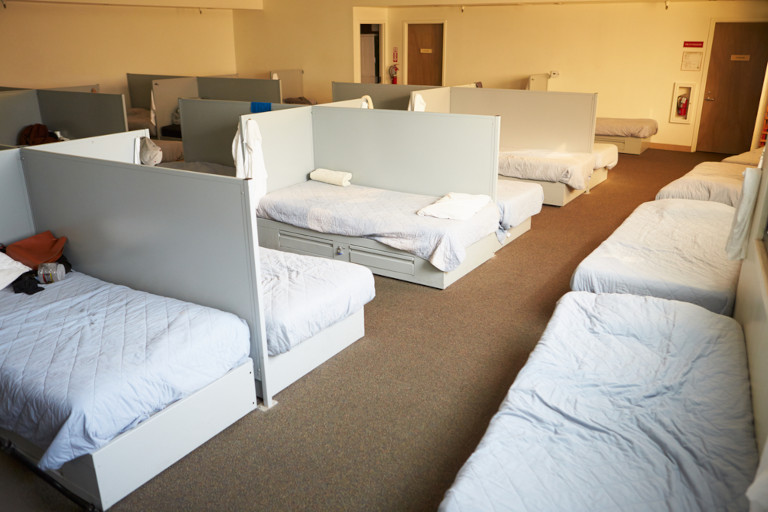 Empty beds in a homeless shelter.