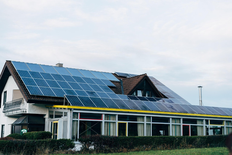 Solar panels on the roof of a home, covering the entire available surface.