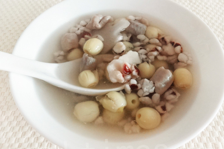 A bowl of Chinese four-ingredient soup made with lotus seeds, Chinese yam, gorgon fruit, and poria mushrooms.