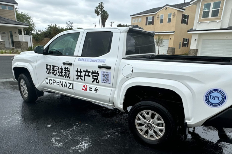 Yuan Zegang's white truck with messages encouraging people to stand up to the Chinese Communist Party.