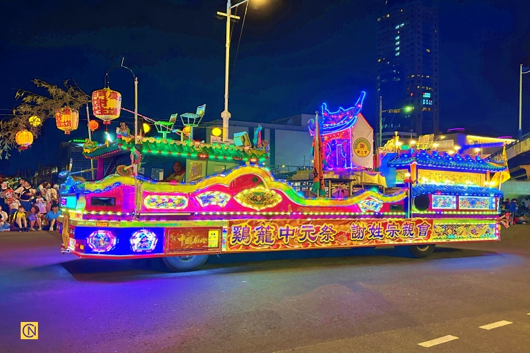 A float with water lanterns and bamboo stalks at the 2025 Keelung Mid-Summer Ghost Festival.