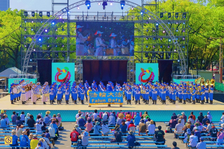 Falun Dafa Tian Guo Marching Band, composed of members from Taiwan and Japan, performing on the main stage at Edion Hisaya Plaza in Hisaya Odori Park.
