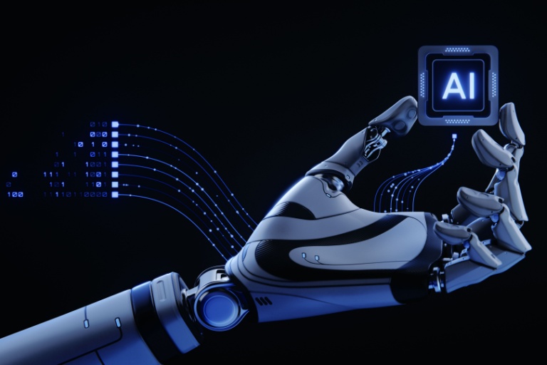 Robotic hand holding a cube that says 'AI.'