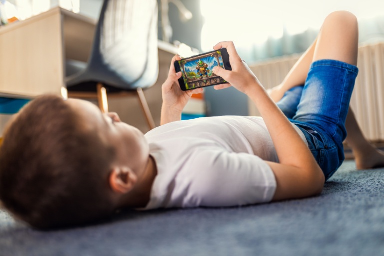 A young boy playing a video game.