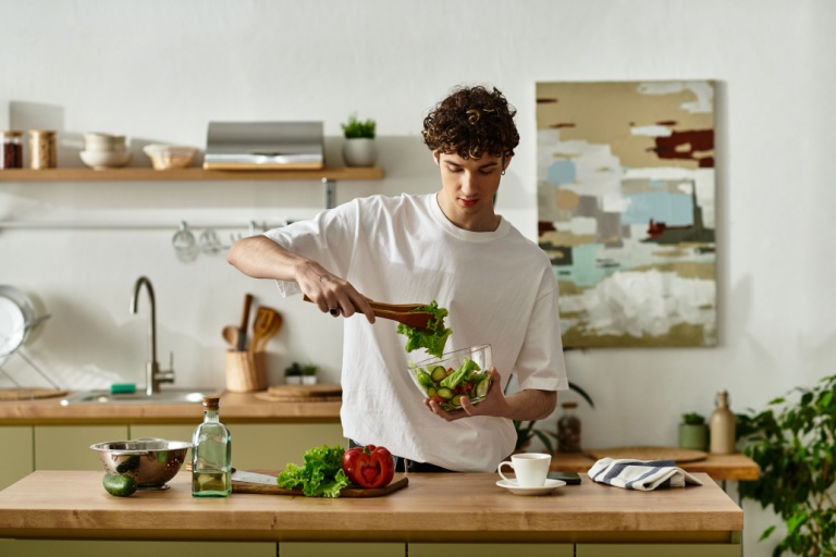 A young man cooking.