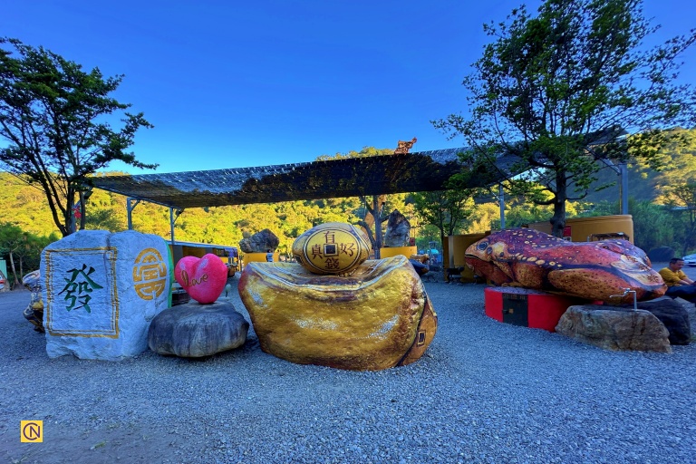 The spacious plaza of Yuanbao Tudi Gong Temple offers an open setting for worship and festive gatherings amid a serene mountain backdrop.