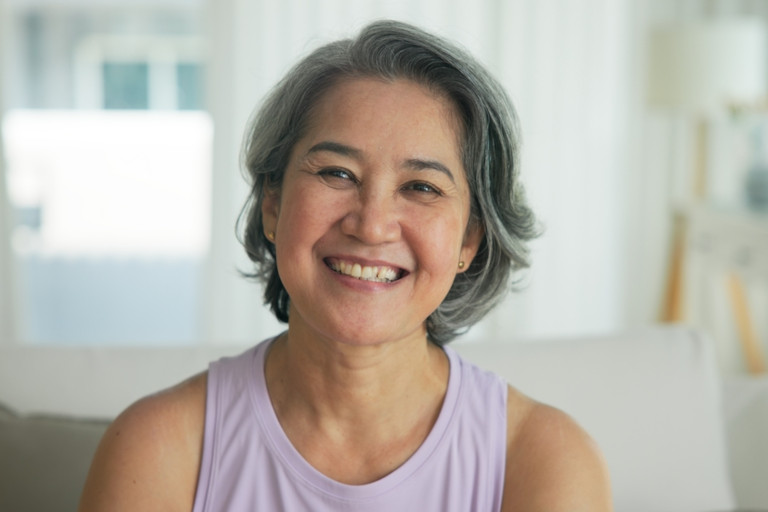 A middle-aged Asian woman.