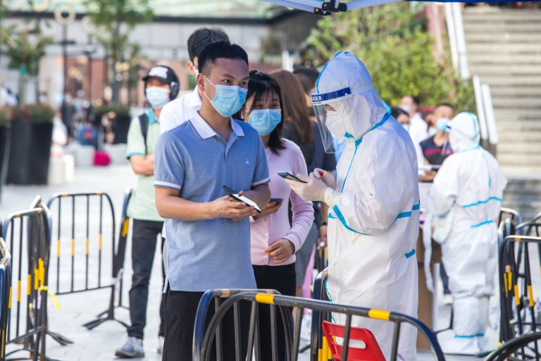 Residents in Shanghai endured a grueling daily routine of early morning lineups for mandatory COVID-19 testing during China's strict three-month lockdown.