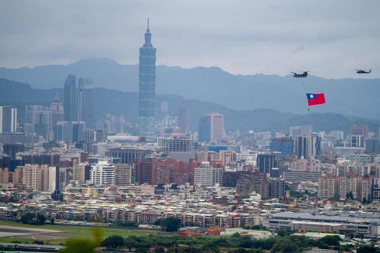 Skyline of Taipei with helicopters flying and displaying Taiwan's flag.