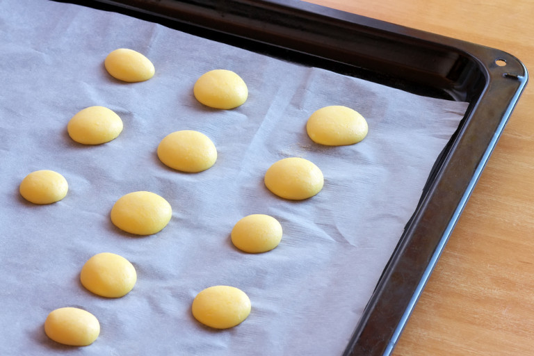 Japanese egg cookie snacks on a baking sheet waiting to go in the oven.