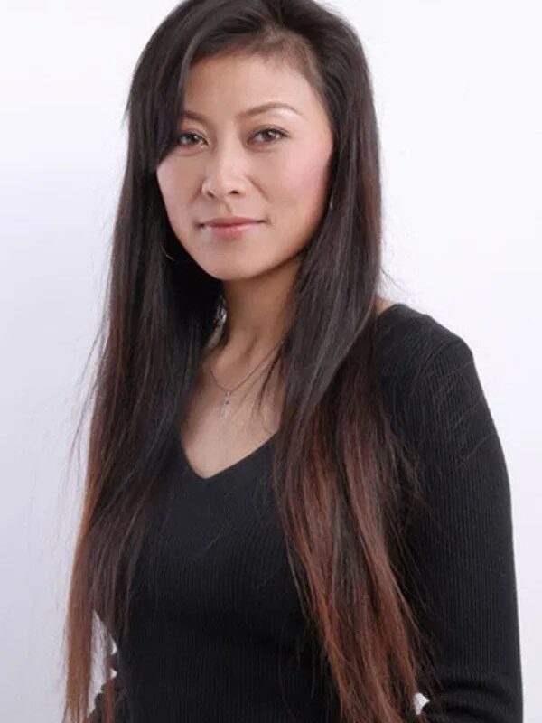 When asked: 'What's the secret to your cancer survival?,' Yue Hong points to her head: 'I won the battle here first.'