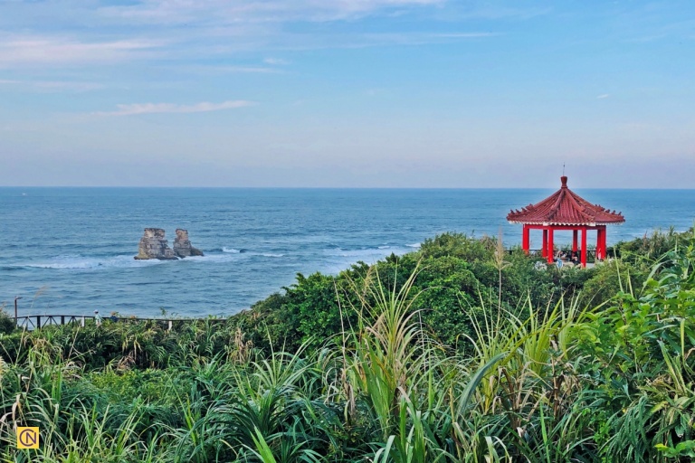 A distant view of the Twin Candlestick Islets under open skies.