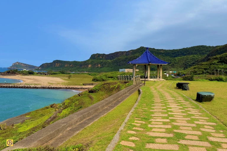 Where a quiet path meets ocean views — Yehliu Cape in the distance.