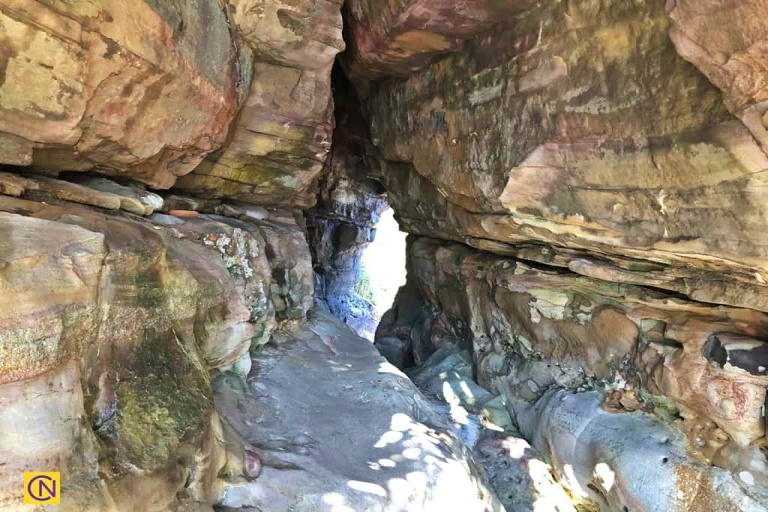 At the Mysterious Coast, 'One-Line Sky' offers a dramatic squeeze through a narrow rock passage.