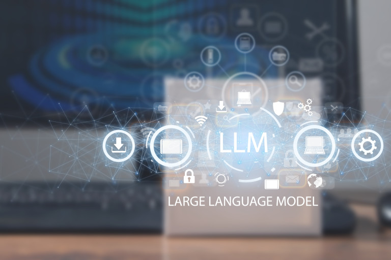 Text for an LLM superimposed on an image of a laptop sitting on a desk.