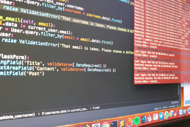 Code editor and terminal windows open on a macOS screen during software development work.