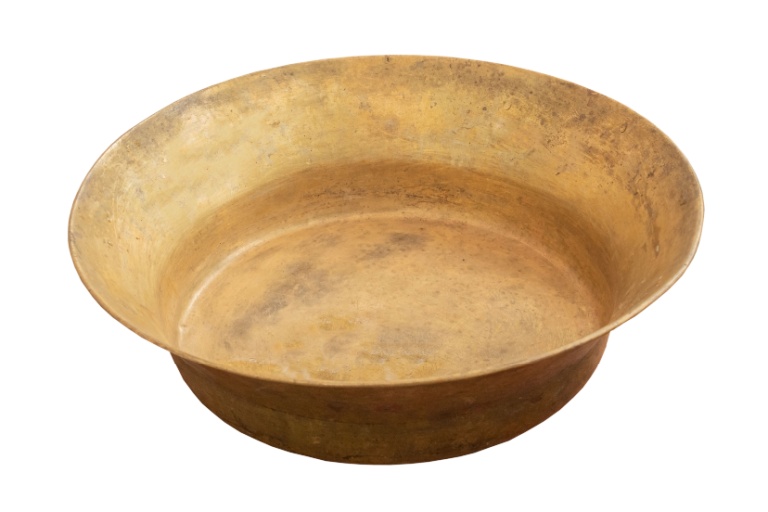 One night, I sat alone in a dimly lit hall. Before me was an old brass basin, scratched with age, half-filled with clear water.