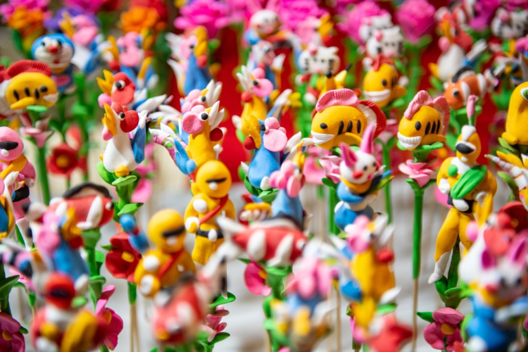 Dough figurines on display at a festival.