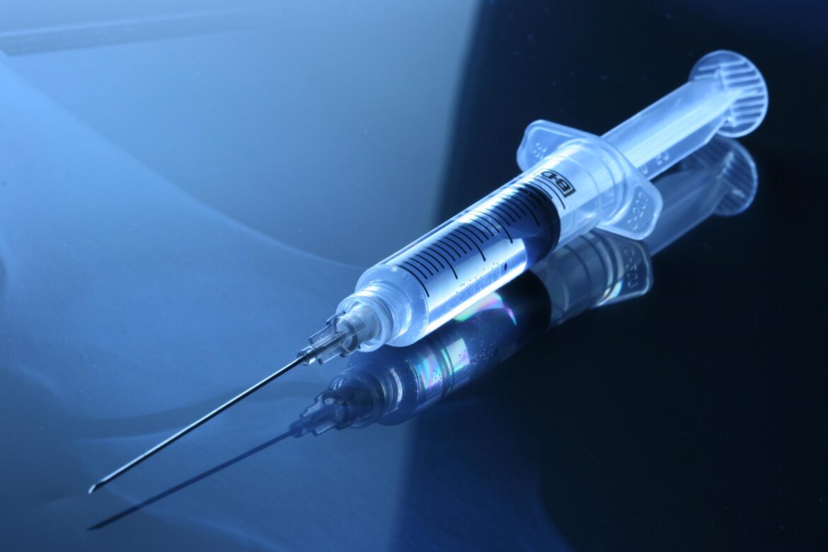 A partially filled syringe.