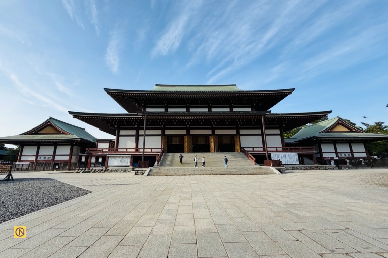The magnificent Daihondo Main Hall stands at the spiritual heart of Naritasan Shinshoji Temple, where visitors gather to pray for peace, protection, and good fortune.