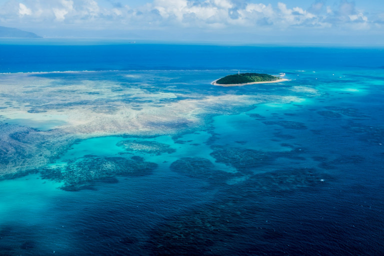 An island surrounded by coral reefs.