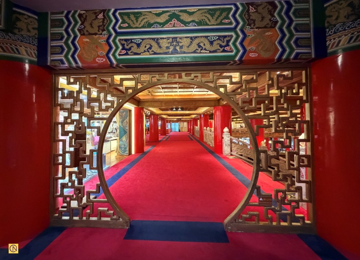 Adorned with intricate dragon motifs and palace-style décor, the Grand Hotel's elegant hallway evokes the grandeur of an imperial residence.