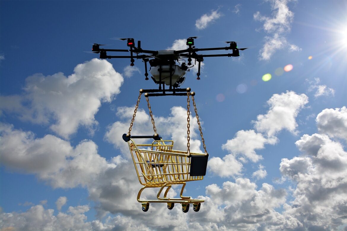 An autonomous drone carrying a shopping cart.