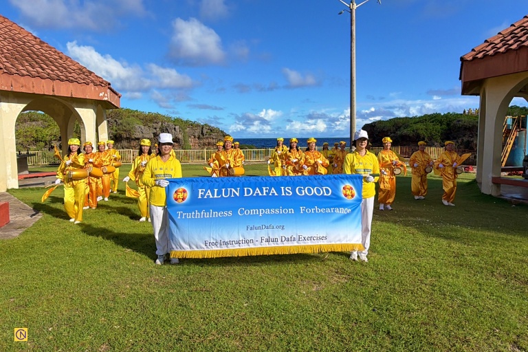 The Waist Drum Team performs at scenic Inarajan Natural Pools.