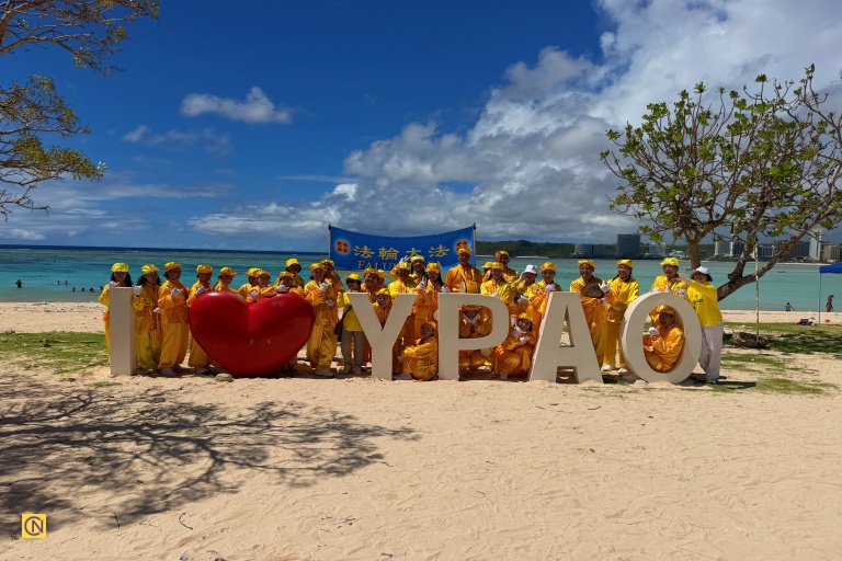 Taiwan's Falun Dafa Waist Drum Team poses for a group photo after performing at Ypao Beach Park.