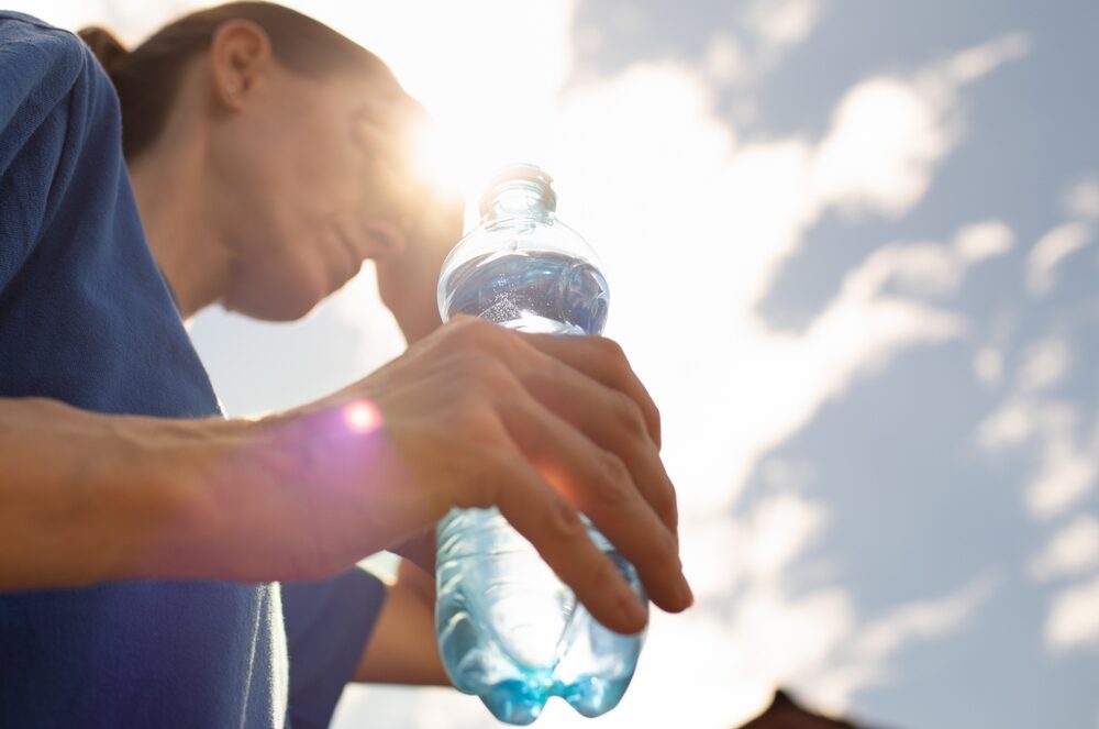 The single most common heat management error is reaching for plain water and stopping there.