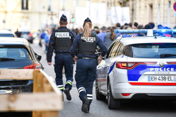 French police patrolling a street in Paris.