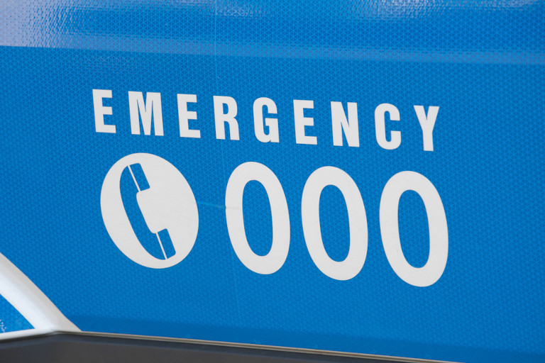 Emergency number 000 in Australia on an ambulance.