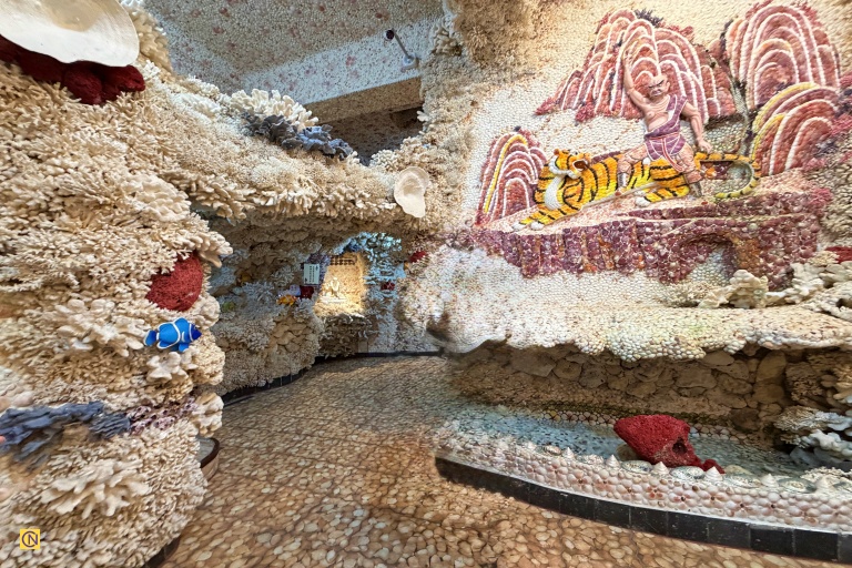 Walking through the Coral Shell Temple’s tunnel feels like stepping into a real-life underwater palace.