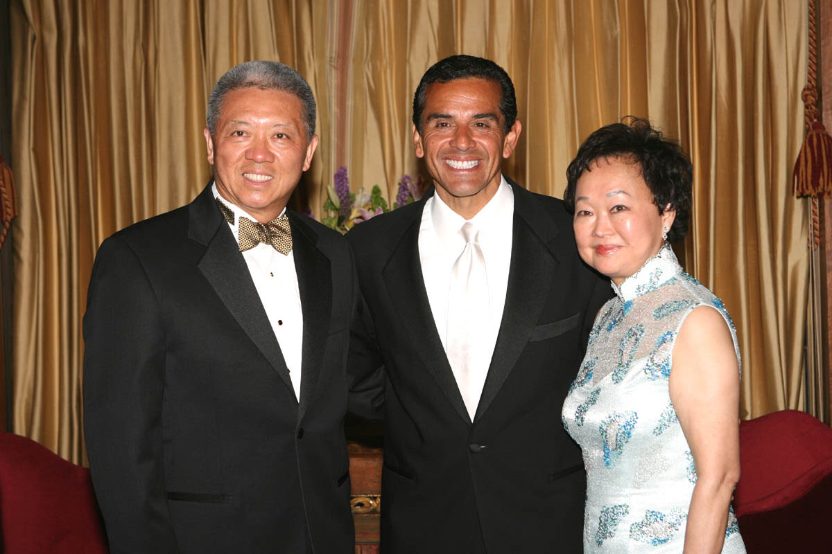 Andrew Cheng (left), founder of Panda Catering Group, the largest Chinese fast food chain in the United States, and his wife, Peggy, with Mayor Villalegousa of McAllen, Texas, at a closing ceremony celebrating Asian Pacific American Heritage Month.