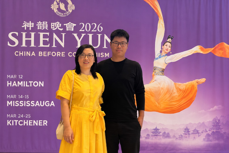 The couple Luo Yu and Wang Jingjing attend a Shen Yun performance. The New York-based company seeks to revive traditional Chinese culture through music and dance, but it cannot perform in mainland China, where the CCP has long suppressed the spiritual and cultural traditions Shen Yun presents.