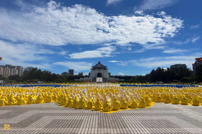 Over 5,000 Falun Gong followers sat in designated positions in meditation postures to form the characters and images.