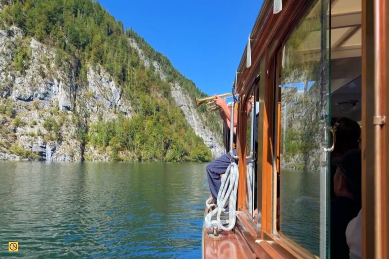 A boat pauses near the famous Echo Wall as the captain plays a trumpet.