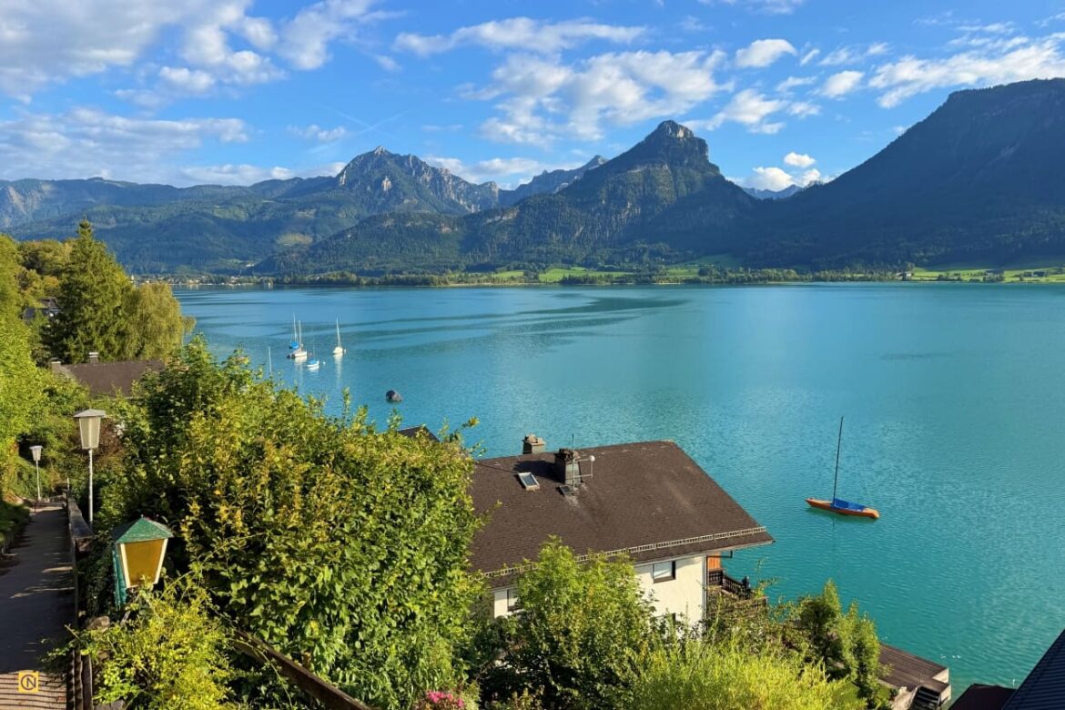Blue waters and majestic mountains frame the charming lakeside villages of Wolfgangsee in Austria.