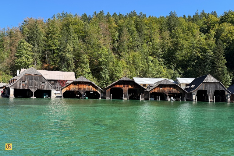 A distinctive wooden boathouse-like structure near the pier.